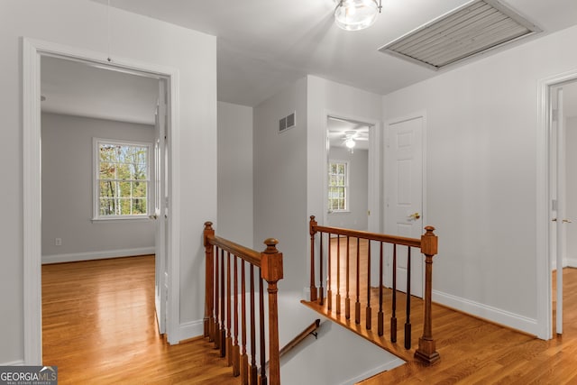 stairs with hardwood / wood-style flooring