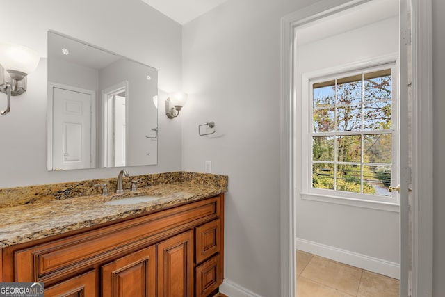 bathroom with tile patterned flooring and vanity