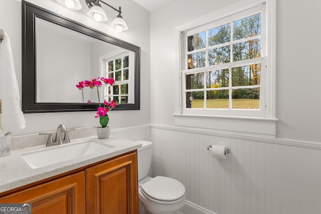 bathroom with vanity and toilet