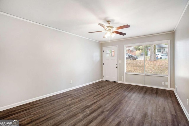 unfurnished room with dark hardwood / wood-style flooring, ceiling fan, and crown molding