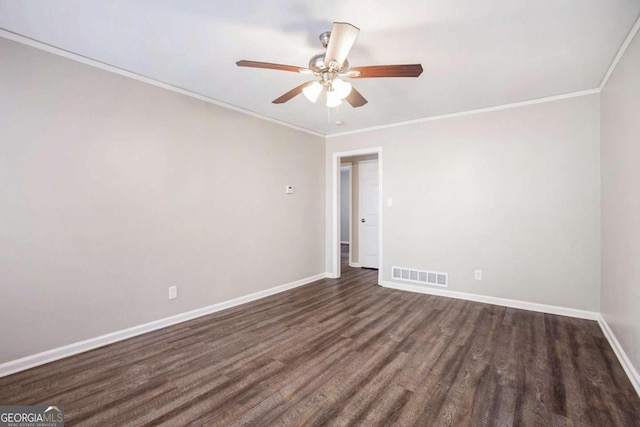 spare room with ceiling fan, dark hardwood / wood-style floors, and crown molding