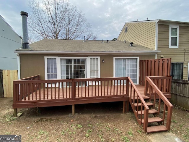 rear view of house with a wooden deck