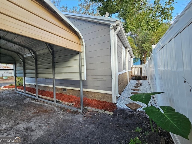 view of home's exterior with a carport