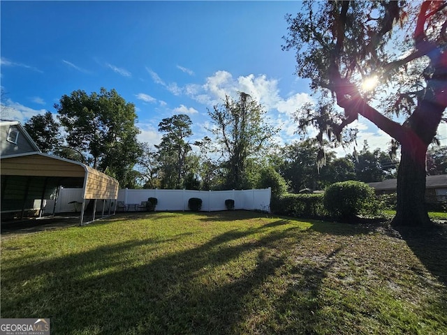 view of yard featuring a carport