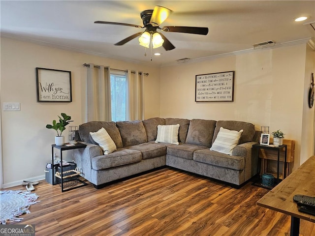 living room featuring crown molding, dark wood-type flooring, and ceiling fan