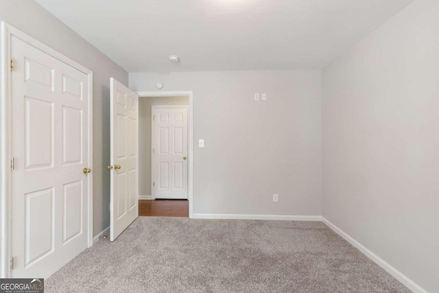 unfurnished bedroom featuring carpet flooring