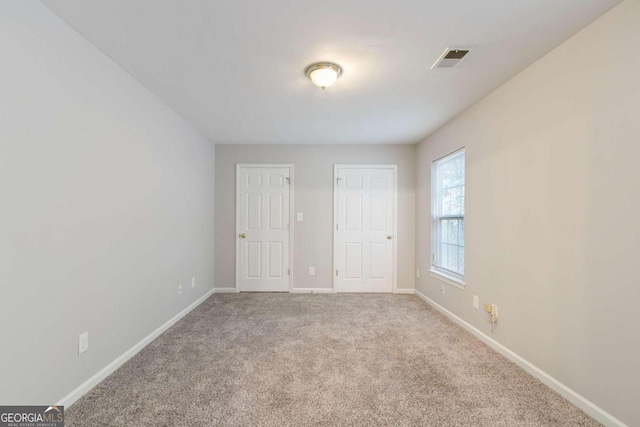 unfurnished bedroom with carpet flooring