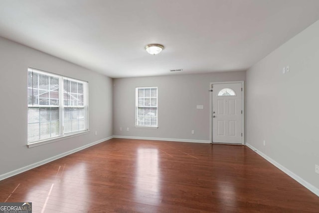 foyer entrance with dark wood-type flooring