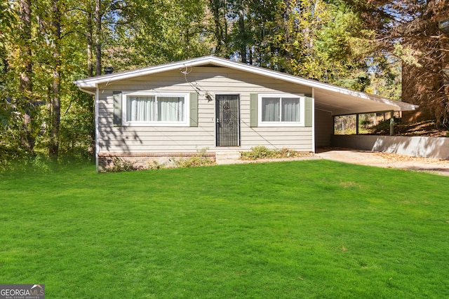 single story home featuring a front lawn and a carport