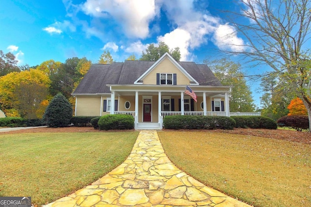 view of front of home with a front lawn and covered porch