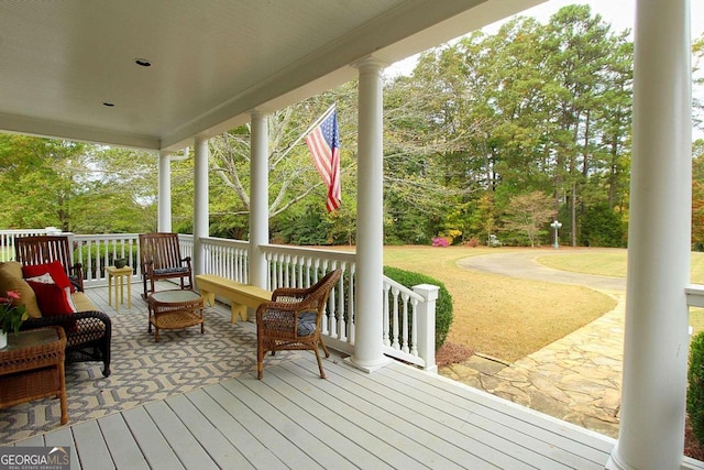 wooden terrace featuring a porch