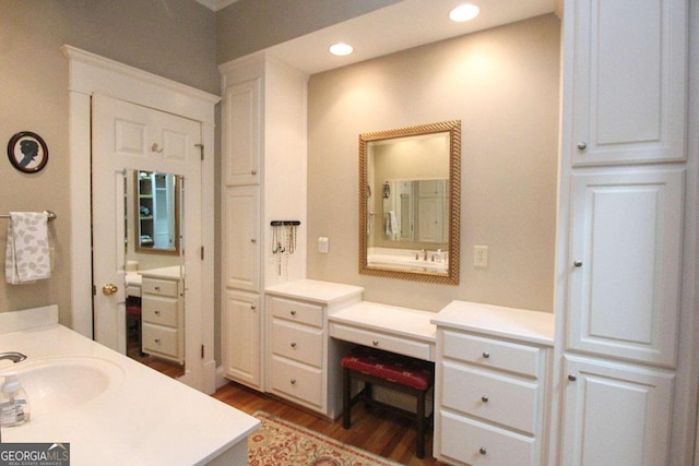 bathroom featuring wood-type flooring and vanity