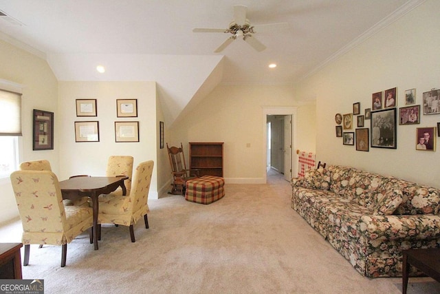 dining area featuring ceiling fan, light carpet, and ornamental molding