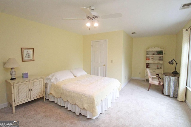 bedroom with ceiling fan and carpet floors