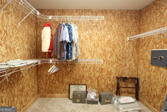 walk in closet featuring carpet