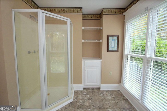 bathroom featuring an enclosed shower