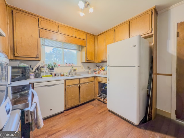 kitchen featuring decorative backsplash, white appliances, sink, and light hardwood / wood-style flooring