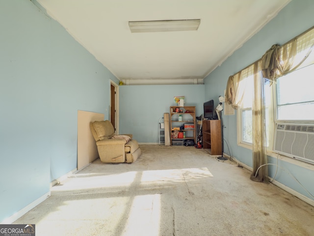 interior space with carpet floors and cooling unit