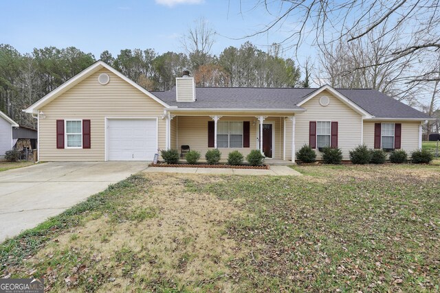 single story home featuring a front lawn, a garage, and a porch