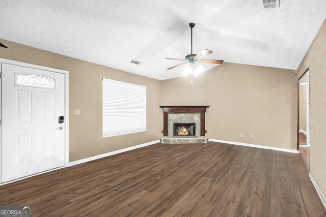 carpeted spare room with a textured ceiling and ceiling fan