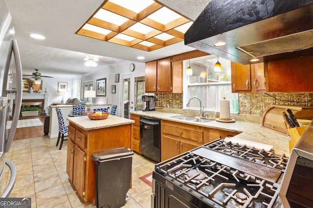 kitchen with range hood, black dishwasher, sink, a kitchen island, and decorative light fixtures