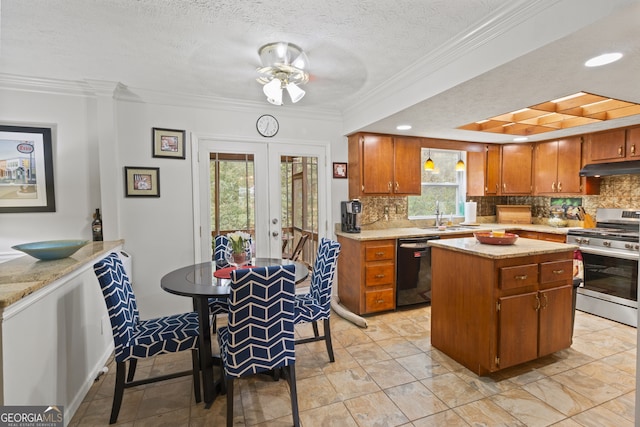 kitchen featuring black dishwasher, a textured ceiling, sink, stainless steel gas stove, and crown molding