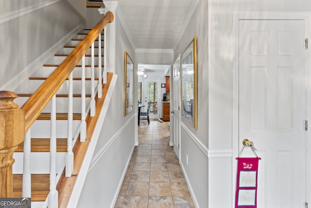 interior space featuring ceiling fan and ornamental molding