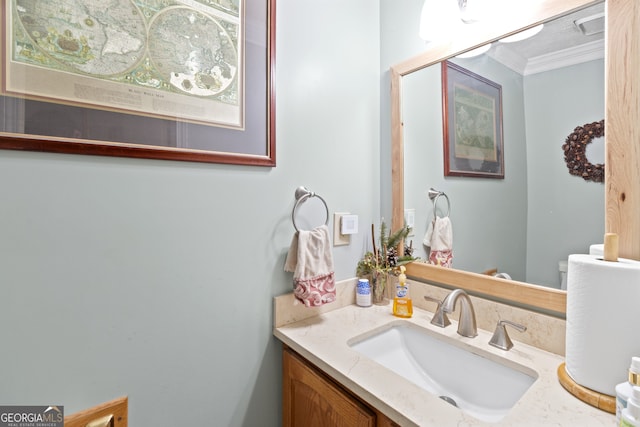 bathroom featuring vanity and crown molding