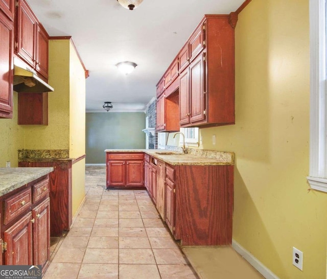 kitchen with light tile patterned floors and sink