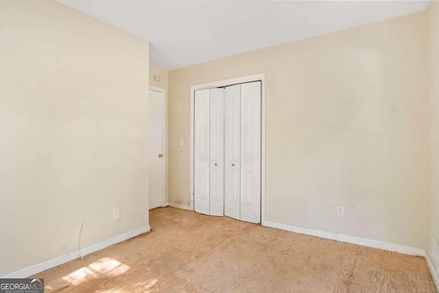 unfurnished bedroom with a closet