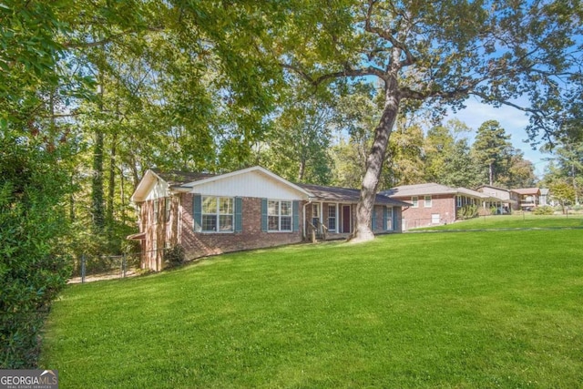 ranch-style house featuring a front lawn