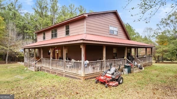 287 Branch Rd, Cedartown, GA 30125 - farmhouse inspired home with a porch and a front yard