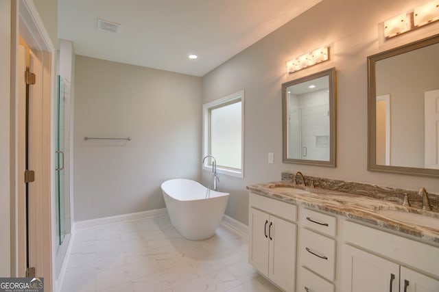 bathroom featuring shower with separate bathtub and vanity