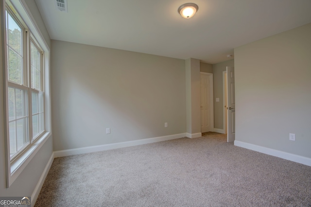 empty room with carpet flooring