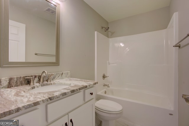 full bathroom with toilet, vanity, and shower / bath combination