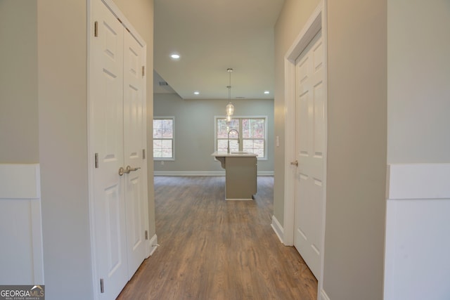 corridor featuring dark hardwood / wood-style flooring