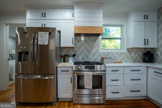 kitchen featuring dark hardwood / wood-style flooring, white cabinetry, and appliances with stainless steel finishes