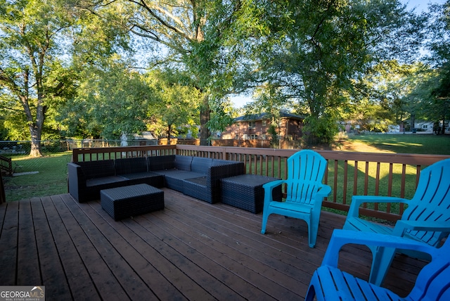 deck with a lawn and an outdoor living space