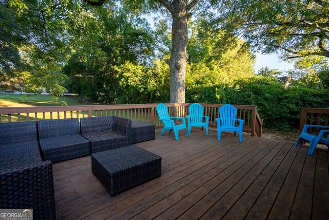 wooden deck with outdoor lounge area