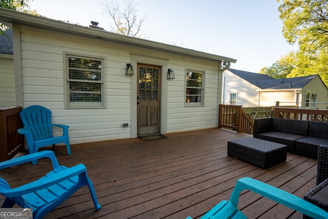 wooden terrace with an outdoor hangout area