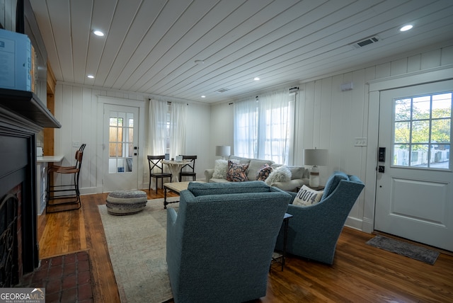 living room with dark hardwood / wood-style floors and wood ceiling