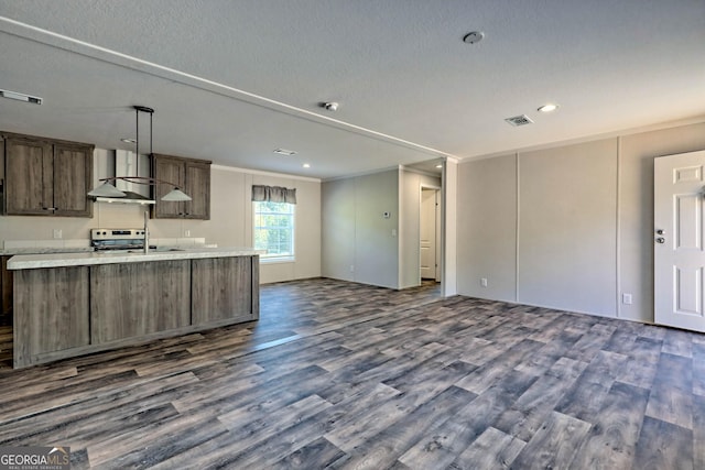 kitchen featuring stainless steel electric range oven, a textured ceiling, dark hardwood / wood-style flooring, and wall chimney exhaust hood