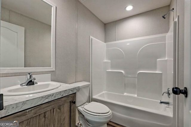 full bathroom featuring shower / tub combination, vanity, and toilet