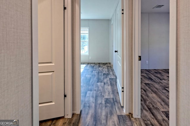 hall with dark hardwood / wood-style floors