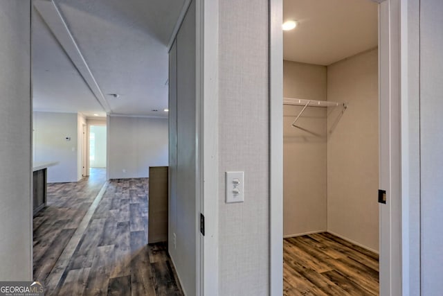 corridor featuring dark hardwood / wood-style floors