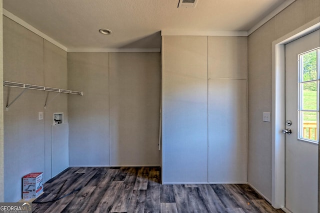 washroom with hookup for a washing machine and dark hardwood / wood-style flooring