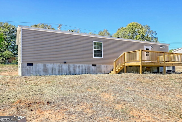 rear view of property with a deck