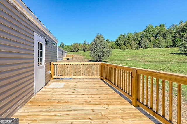 deck featuring a yard