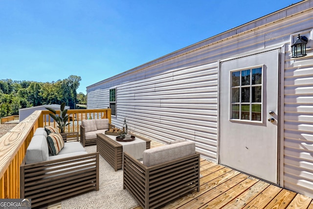 wooden deck featuring an outdoor living space