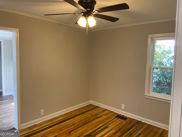 spare room with crown molding, hardwood / wood-style flooring, and ceiling fan